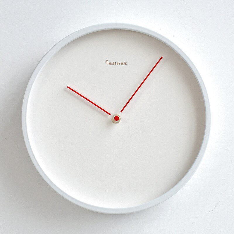 Minimalistische wandklok van mat kunststof en glas - Vessina