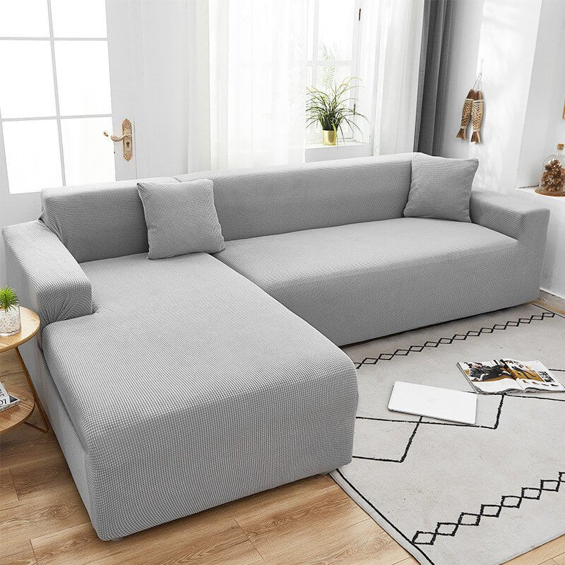 Bankhoes van rekbare stof, textuurafwerking en antislip pasvorm - Vessina