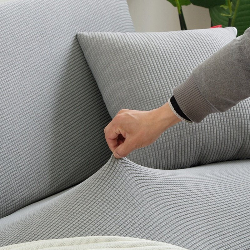 Bankhoes van rekbare stof, textuurafwerking en antislip pasvorm - Vessina