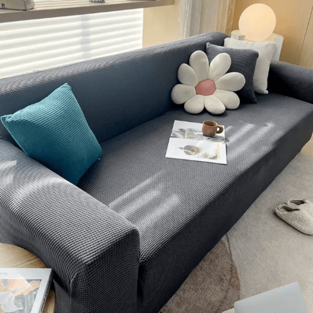 Bankhoes van rekbare stof, textuurafwerking en antislip pasvorm - Vessina